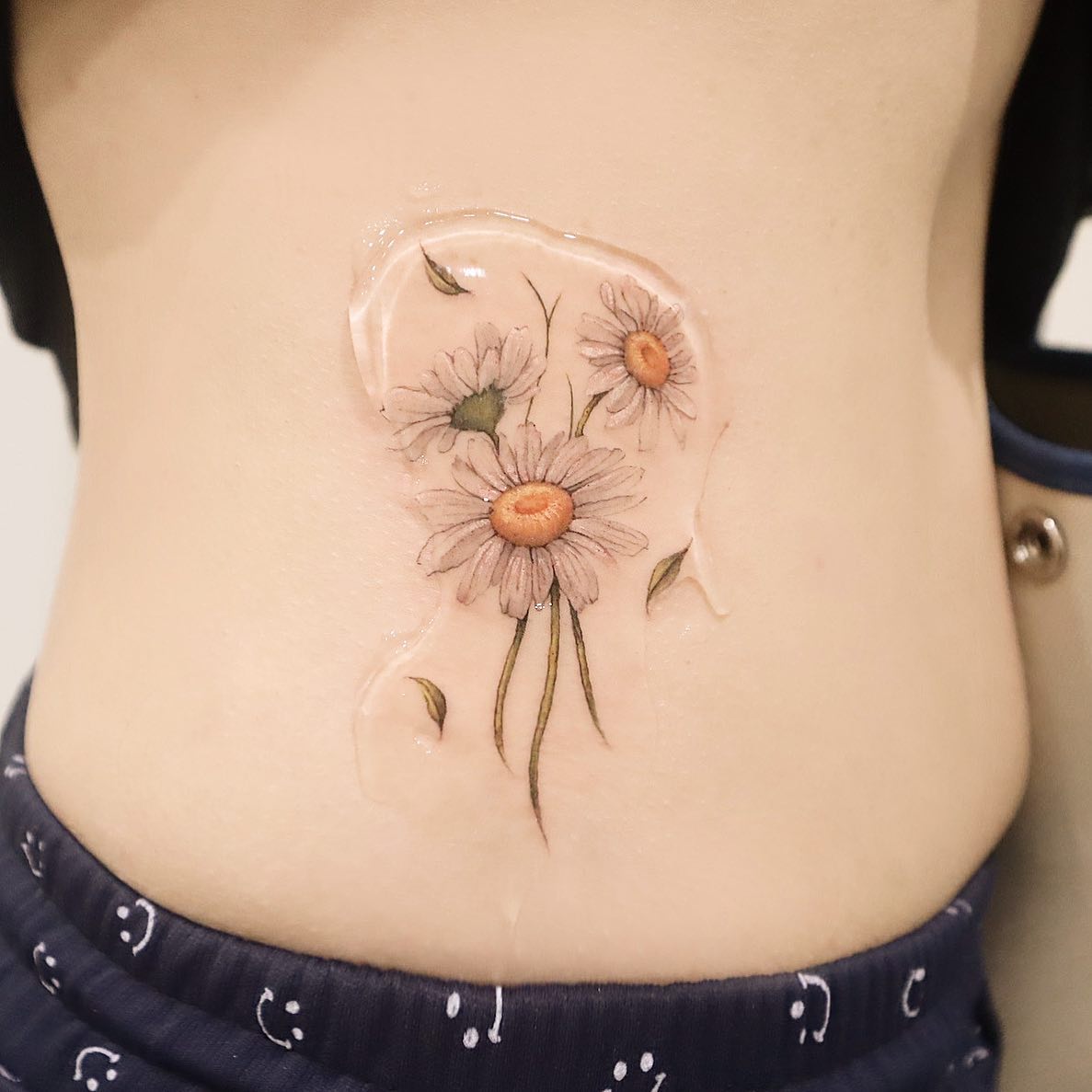 Tatuaje de Margarita de Estómago Blanco