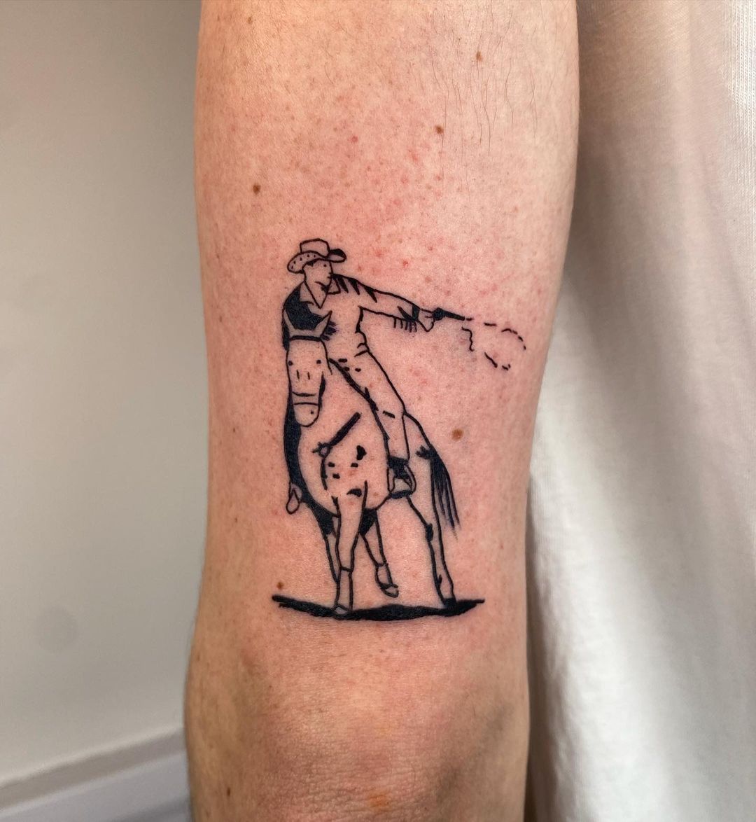 Pequeño tatuaje de vaquero para hombres.