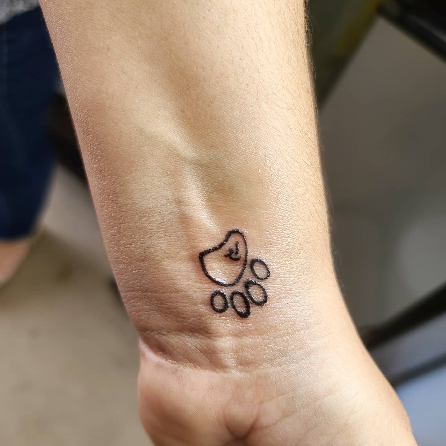 Tatuaje de Pequeña Pata para Hombres