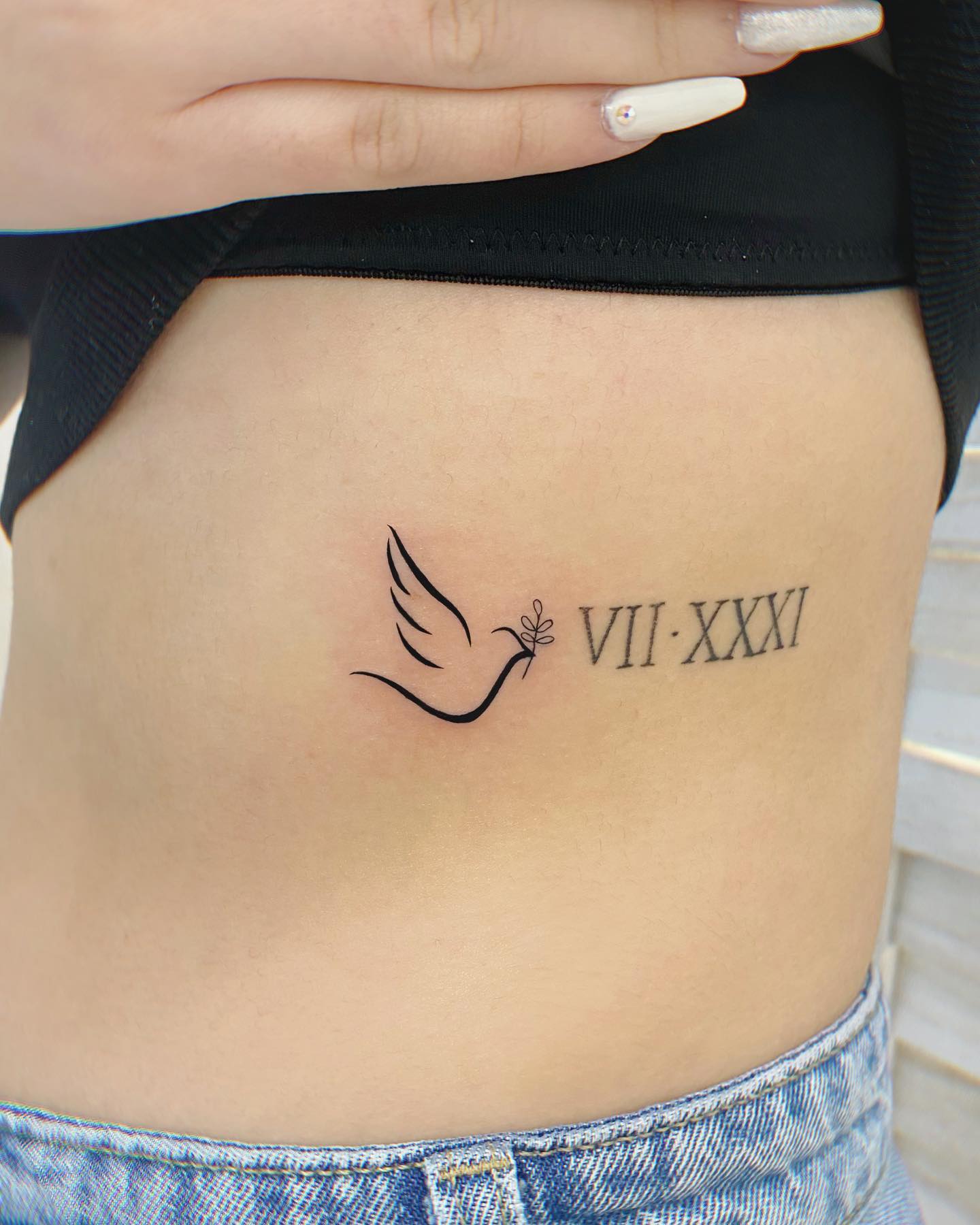 Tatuaje de Paloma en las Costillas