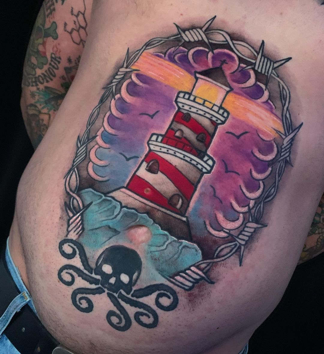 Diseño de tatuaje del faro del estómago gigante.