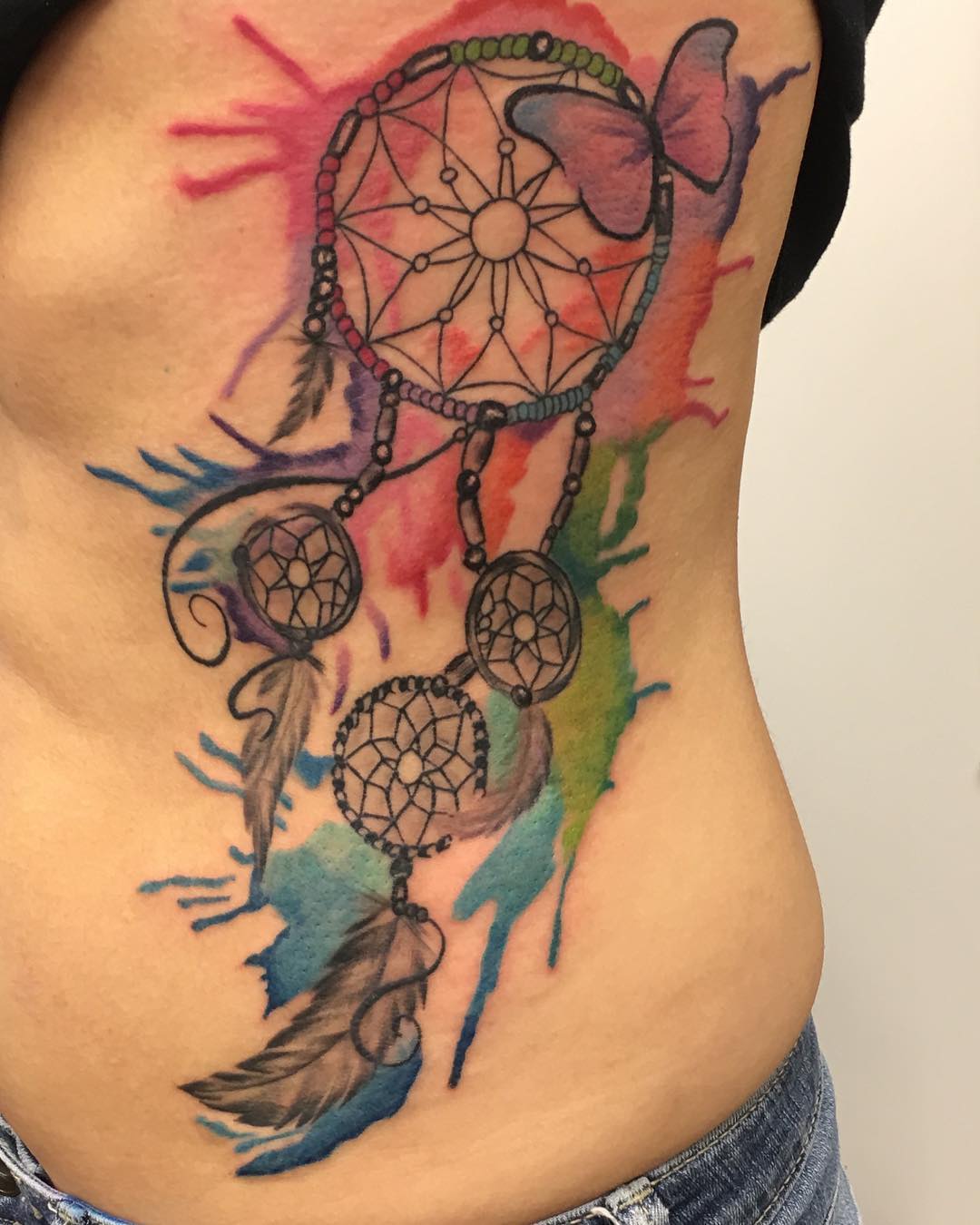 Tatuaje de atrapasueños en acuarela