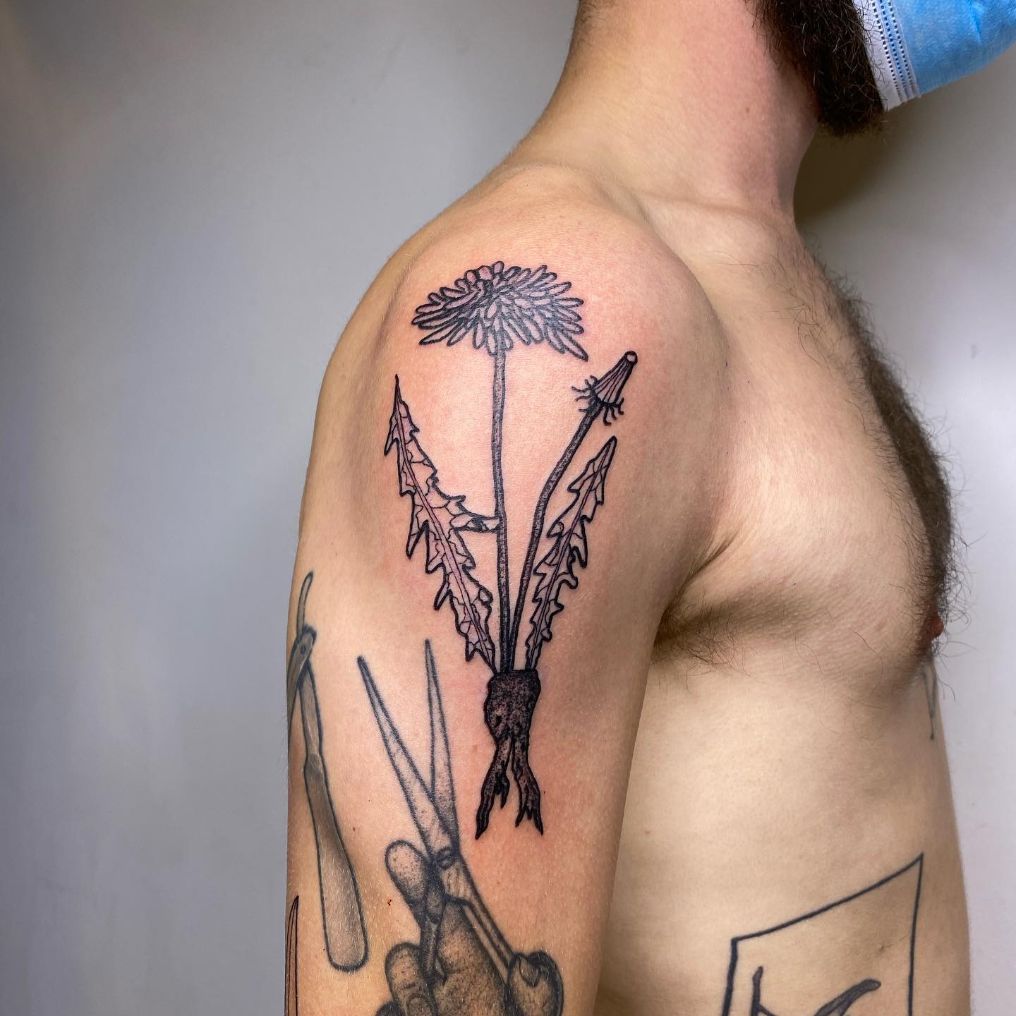 Tatuaje de diente de león para hombres