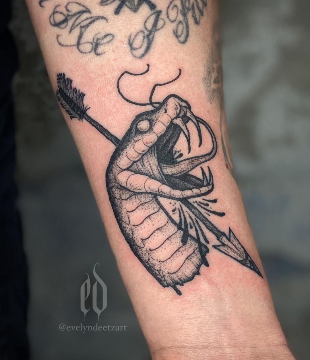 Tatuaje de Serpiente en el Brazo