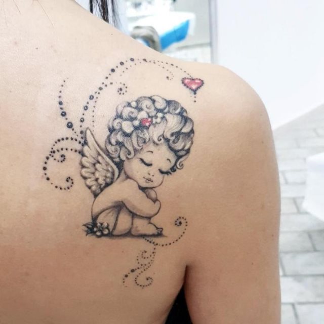 tattoo femenino con un angel 21
