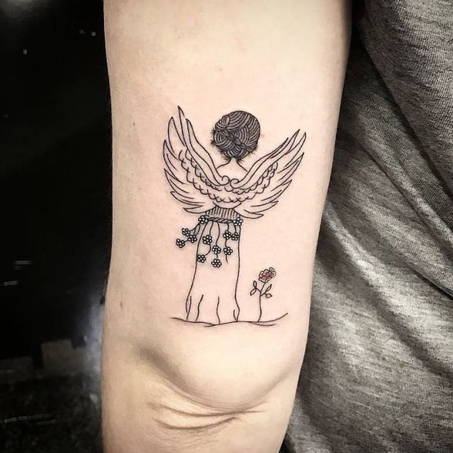 tattoo femenino con un angel 25