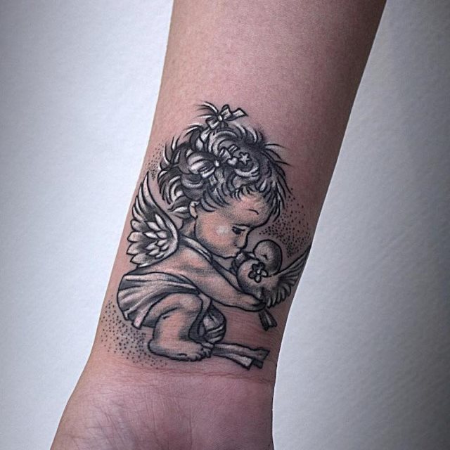 tattoo femenino con un angel 27
