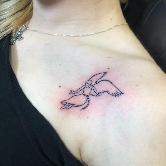tattoo femenino con un angel 37