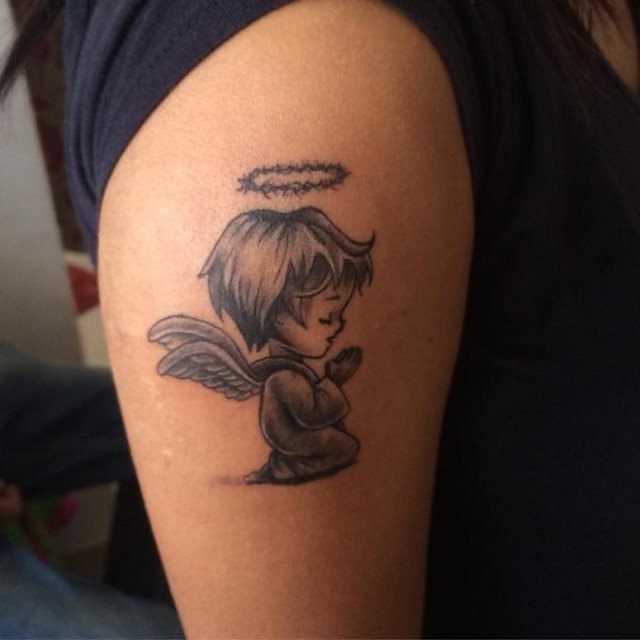 tattoo femenino con un angel 38