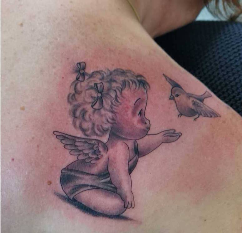 tattoo femenino con un angel 45