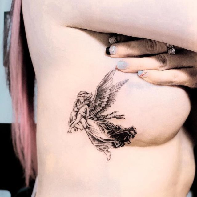 tattoo femenino con un angel 52
