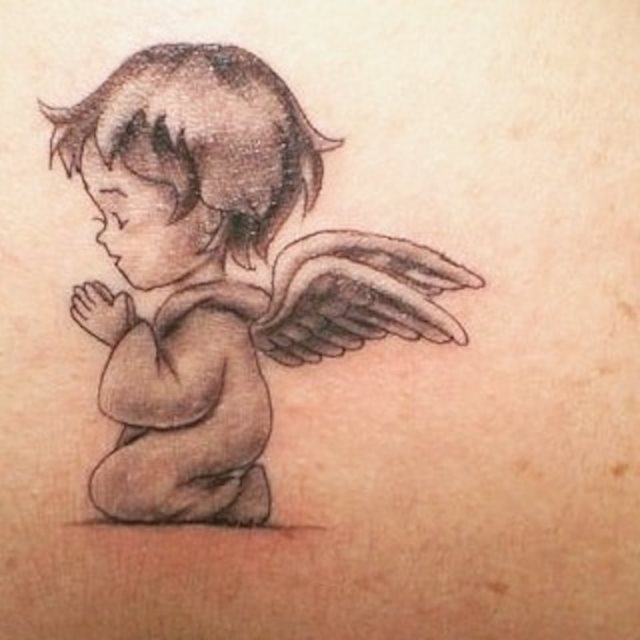 tattoo femenino con un angel 63