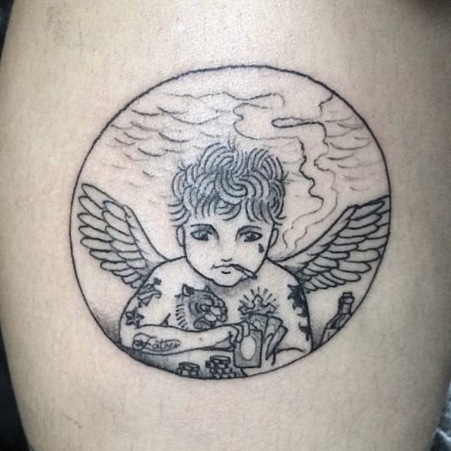 tattoo femenino con un angel 69