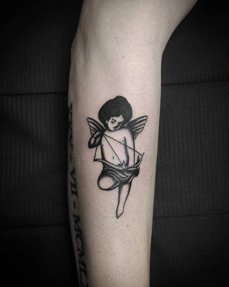 tattoo femenino con un angel 79
