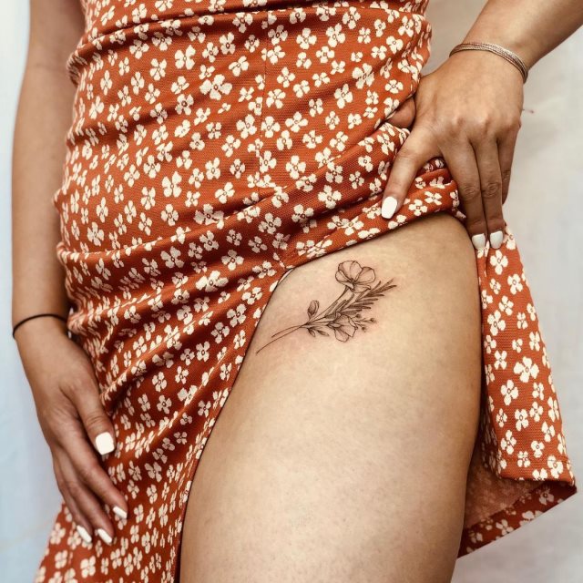 tattoo femenino flor en la pierna 06