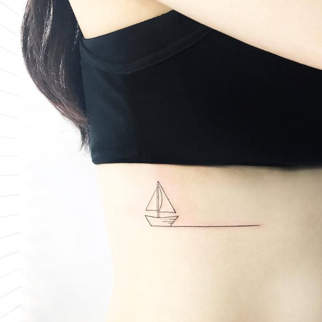 tattoo femenino pequeno en el brazo 27