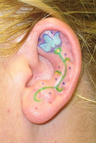 Diseo de una flor en tonos verdes, amarillos y azules Diseo de una flor en tonos verdes, amarillos y azules