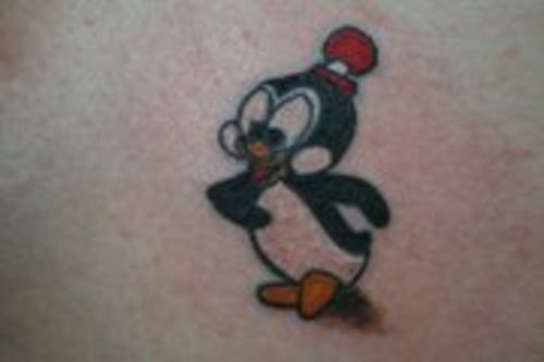 Diseo de un pingino con un sombrero rojo Diseo de un pingino con un sombrero rojo