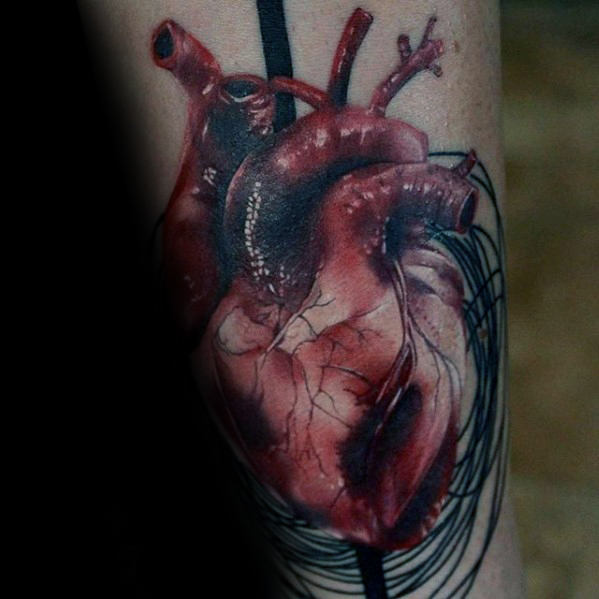 tatuaje corazon realista para hombre 14