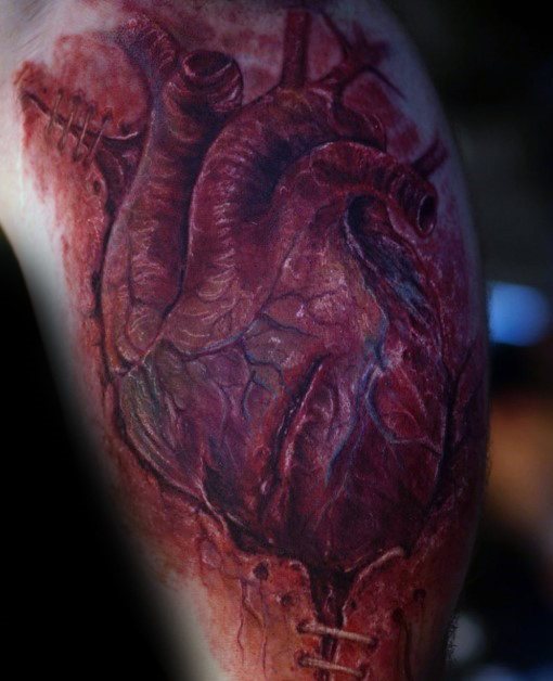 tatuaje corazon realista para hombre 20