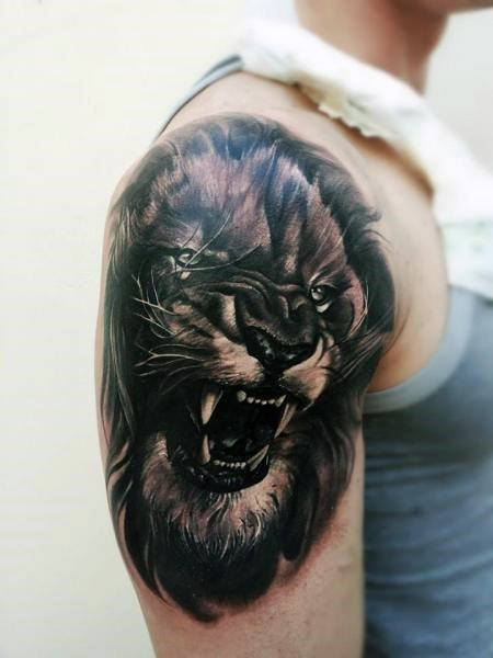 tatuaje leon realista para hombre 13