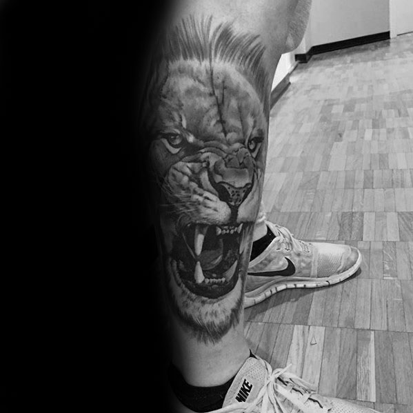 tatuaje leon realista para hombre 20