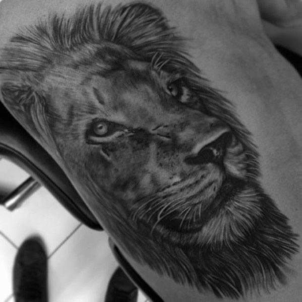 tatuaje leon realista para hombre 40