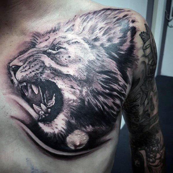 tatuaje leon hombro para hombre 31