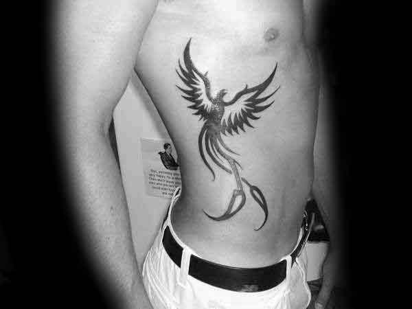 tatuaje fenix tribal para hombre 12
