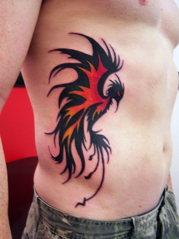 tatuaje fenix tribal para hombre 24