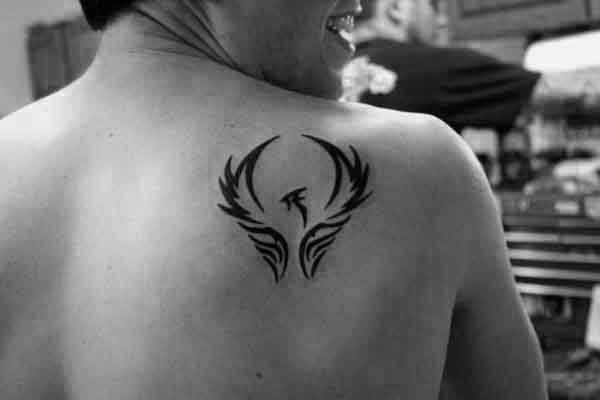 tatuaje fenix tribal para hombre 32