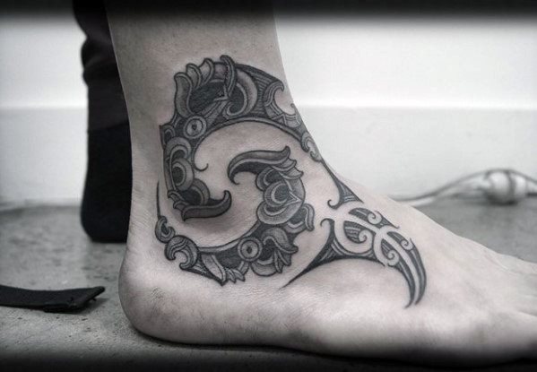 tatuaje tribal pie para hombre 27