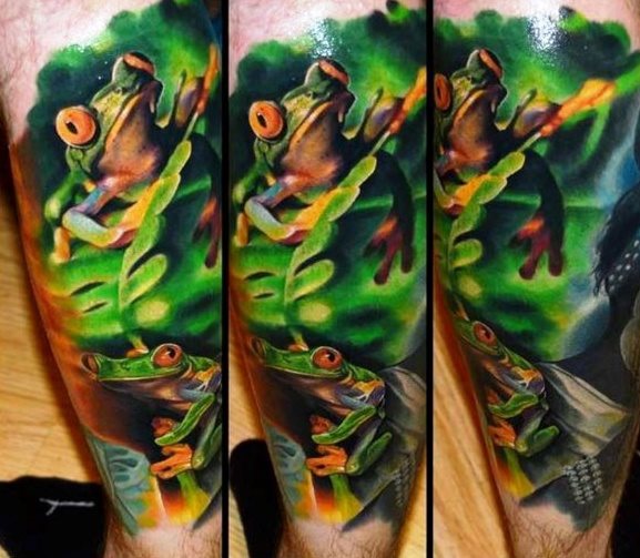 tatuaje rana en arbol para hombre 37